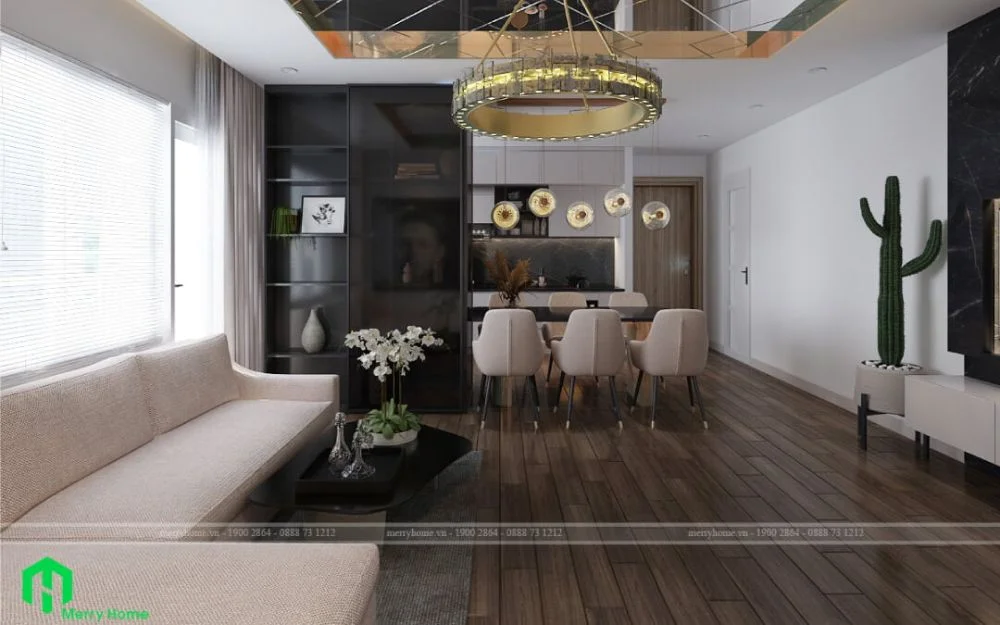 Sofa bên trái, bàn ăn trung tâm, tủ bếp phía sau tạo bố cục cân đối